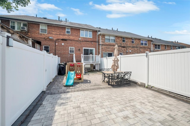 239-53 66th Ave, Little Neck, NY 11362 - fenced backyard with a patio area, outdoor dining space, cooling unit, and a residential view