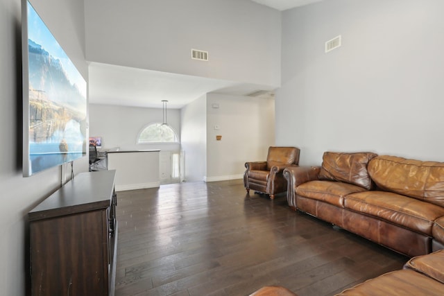 403 Haverstraw Rd, Suffern, NY 10901 - living room featuring a towering ceiling, dark wood-style floors, and baseboards