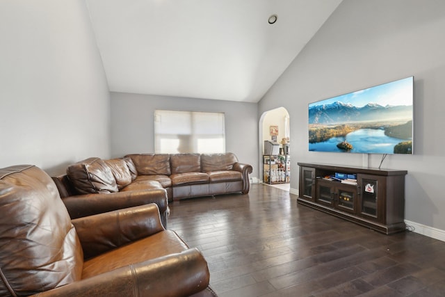 403 Haverstraw Rd, Suffern, NY 10901 - living room with arched walkways, dark wood-style flooring, baseboards, and high vaulted ceiling