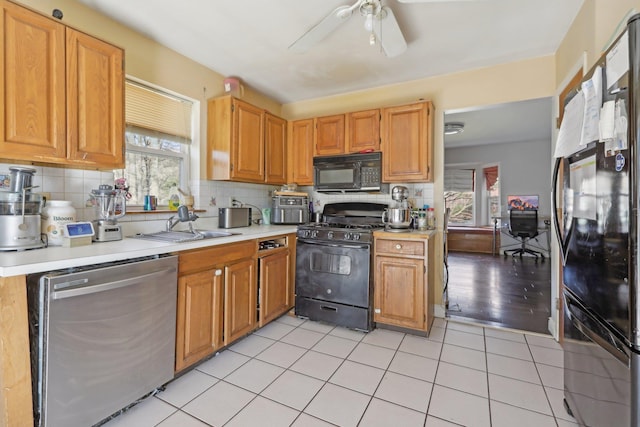403 Haverstraw Rd, Suffern, NY 10901 - kitchen featuring black appliances, light countertops, ceiling fan, tasteful backsplash, and a sink