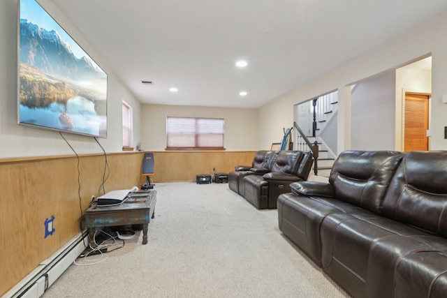 403 Haverstraw Rd, Suffern, NY 10901 - carpeted living area featuring baseboard heating, stairway, wainscoting, wooden walls, and recessed lighting