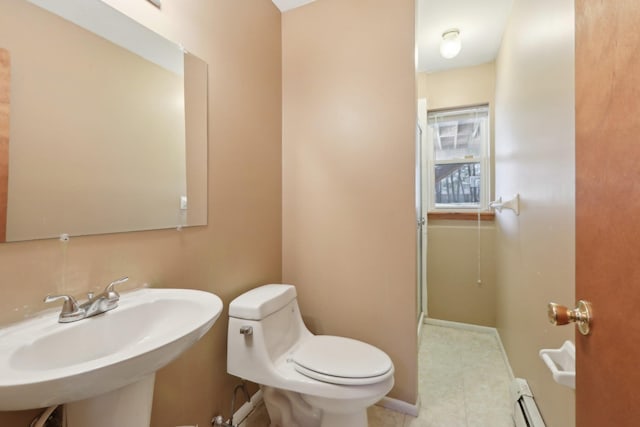 403 Haverstraw Rd, Suffern, NY 10901 - bathroom with a sink, toilet, a baseboard heating unit, and baseboards