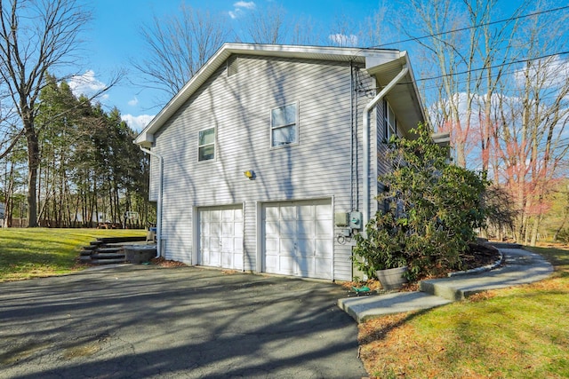 403 Haverstraw Rd, Suffern, NY 10901 - view of side of home with asphalt driveway and an attached garage