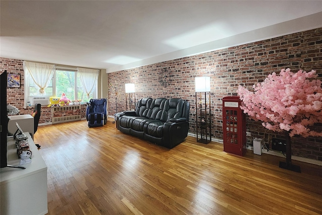 209-2018th Ave 5E, Bayside, NY 11360 - living area featuring brick wall, wood finished floors, and cooling unit