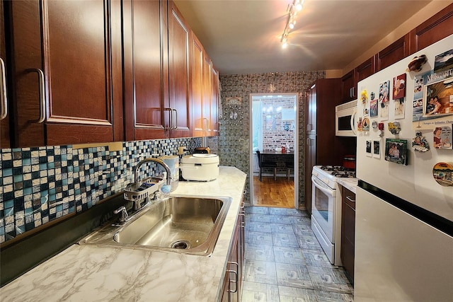 209-2018th Ave 5E, Bayside, NY 11360 - kitchen with white appliances, a sink, light countertops, light flooring, and dark brown cabinets