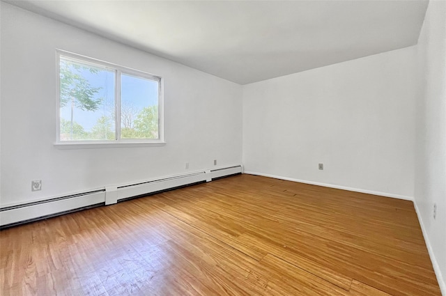4 Red Barn Ln, Middletown, NY 10940 - empty room featuring wood finished floors, baseboard heating, and baseboards
