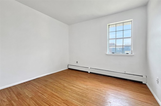 4 Red Barn Ln, Middletown, NY 10940 - unfurnished room featuring a baseboard heating unit, wood finished floors, and baseboards
