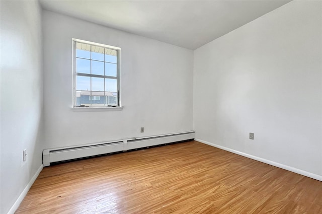 4 Red Barn Ln, Middletown, NY 10940 - unfurnished room with light wood-style flooring, a baseboard radiator, and baseboards