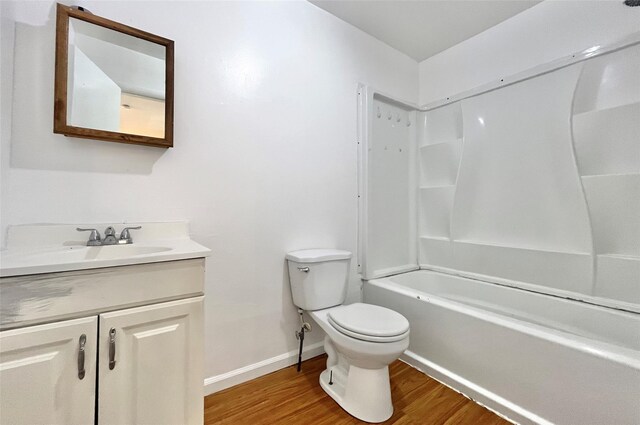 4 Red Barn Ln, Middletown, NY 10940 - full bathroom featuring wood finished floors, vanity, toilet, baseboards, and bathing tub / shower combination
