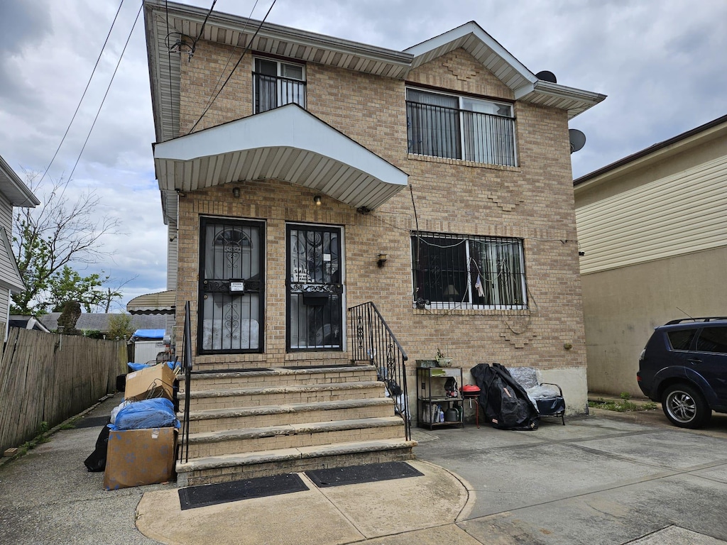 14008 Foch Blvd, Jamaica, NY 11436 - view of front of house featuring brick siding and entry steps