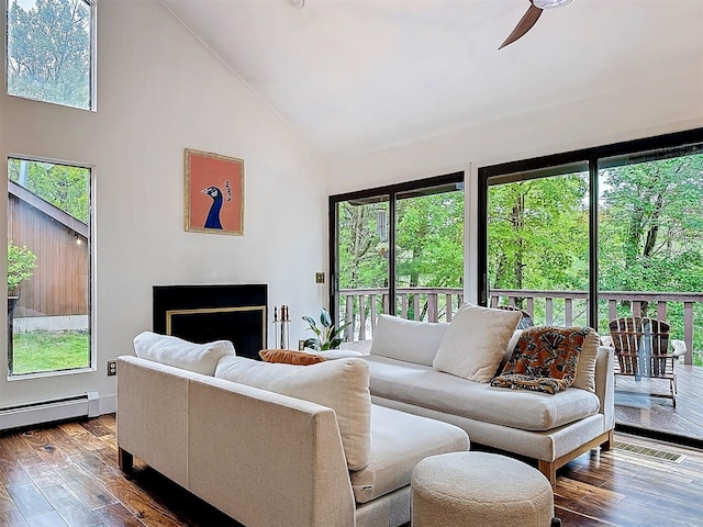 24 Lakeview Ter, Monticello, NY 12701 - living room featuring high vaulted ceiling, ceiling fan, wood-type flooring, a fireplace, and a baseboard radiator