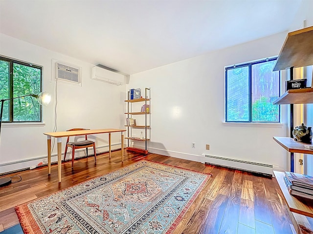 24 Lakeview Ter, Monticello, NY 12701 - sitting room with a baseboard radiator, a wall mounted air conditioner, wood finished floors, a wall mounted AC, and a baseboard heating unit