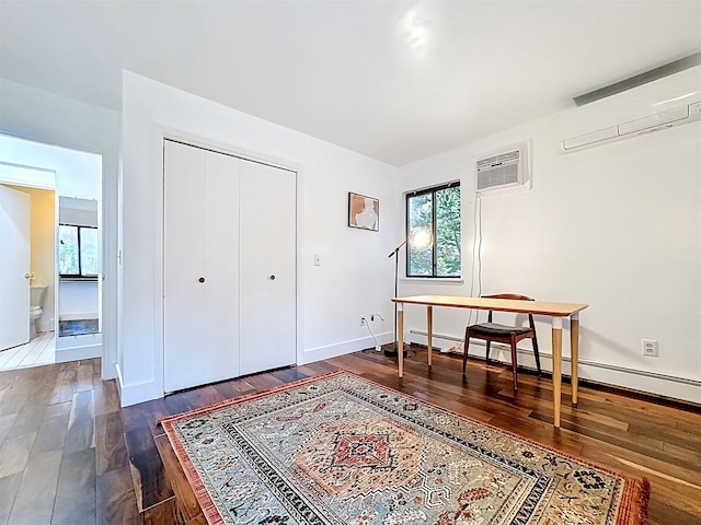 24 Lakeview Ter, Monticello, NY 12701 - office with a wall mounted AC, dark wood finished floors, healthy amount of natural light, and baseboard heating