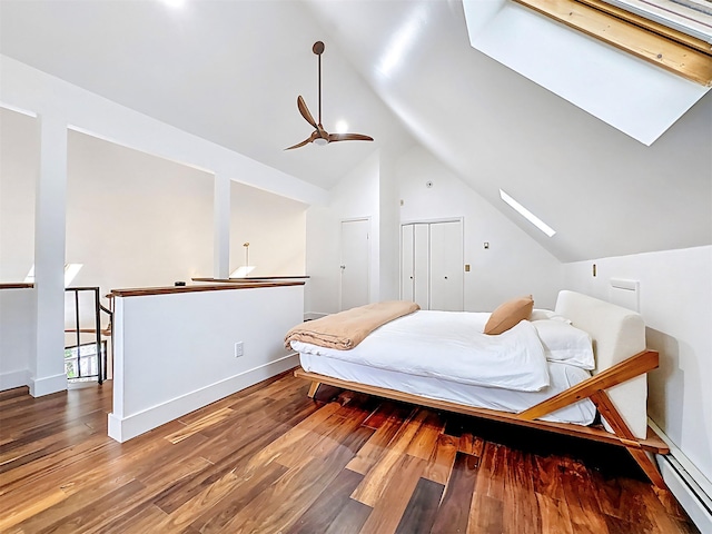 24 Lakeview Ter, Monticello, NY 12701 - bedroom featuring lofted ceiling, a skylight, wood finished floors, and baseboard heating