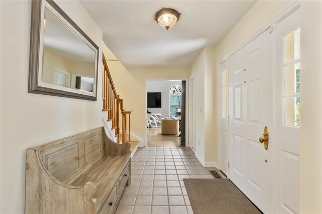 41 Indian Hill Rd, Brewster, NY 10509 - entrance foyer featuring light tile patterned floors and stairway