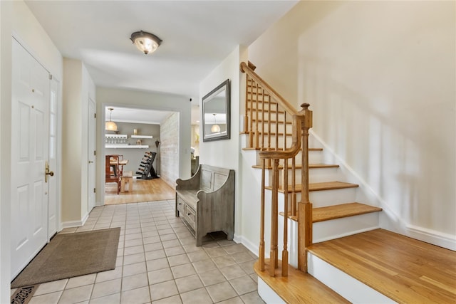 41 Indian Hill Rd, Brewster, NY 10509 - foyer featuring light tile patterned flooring and stairs