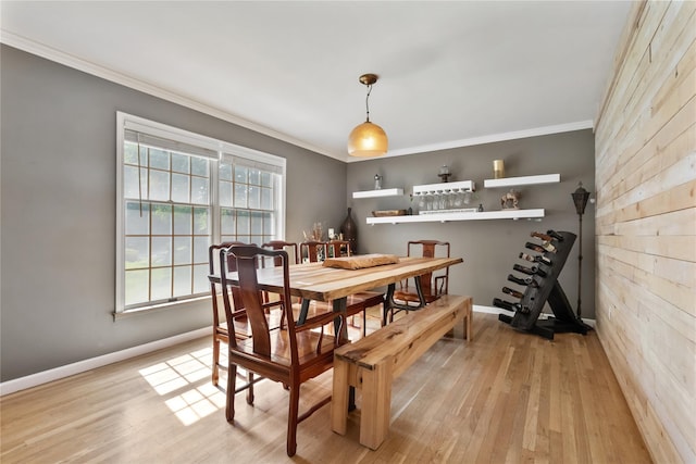 41 Indian Hill Rd, Brewster, NY 10509 - dining space with ornamental molding, wood walls, and light wood finished floors