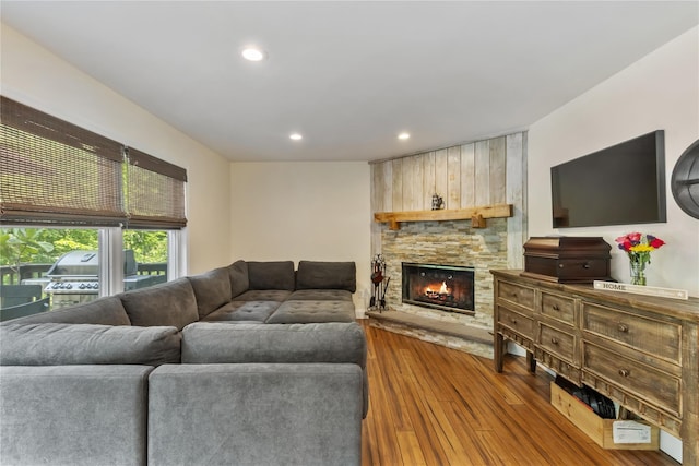 41 Indian Hill Rd, Brewster, NY 10509 - living area with wood-type flooring, a stone fireplace, and recessed lighting