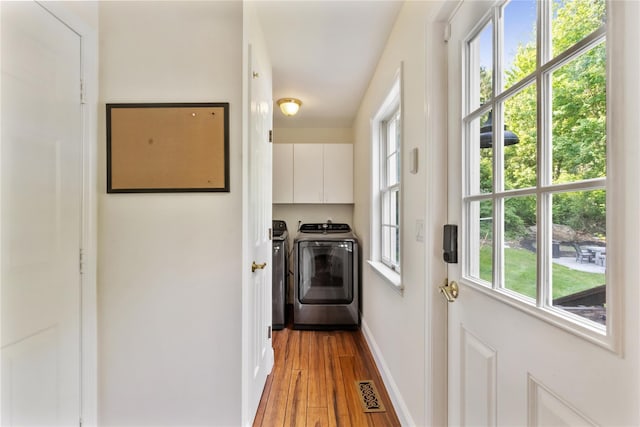 41 Indian Hill Rd, Brewster, NY 10509 - washroom featuring cabinet space, washer and dryer, and light wood-style flooring