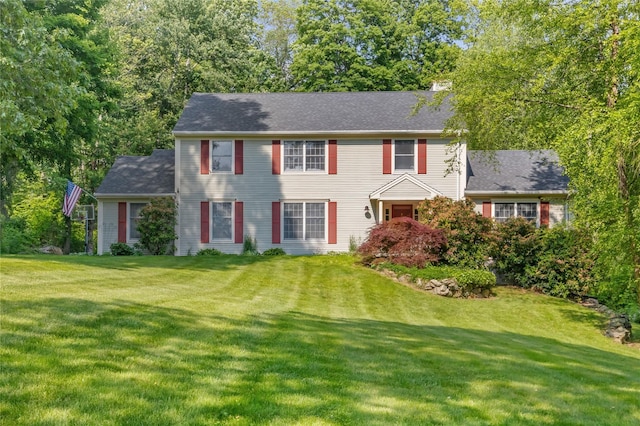 41 Indian Hill Rd, Brewster, NY 10509 - colonial-style house featuring a front lawn and a chimney