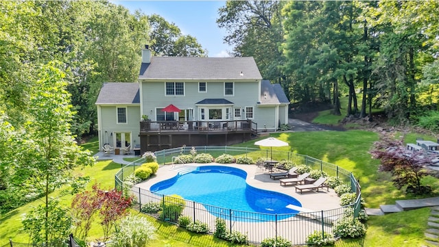 41 Indian Hill Rd, Brewster, NY 10509 - back of house featuring a chimney, a wooden deck, a patio area, french doors, and view of wooded area