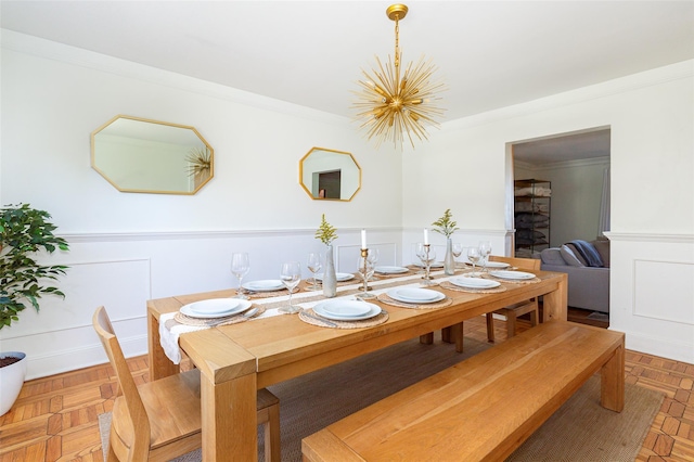 53 Vista Ln, Port Jervis, NY 12771 - dining space with a chandelier, wainscoting, a decorative wall, and ornamental molding