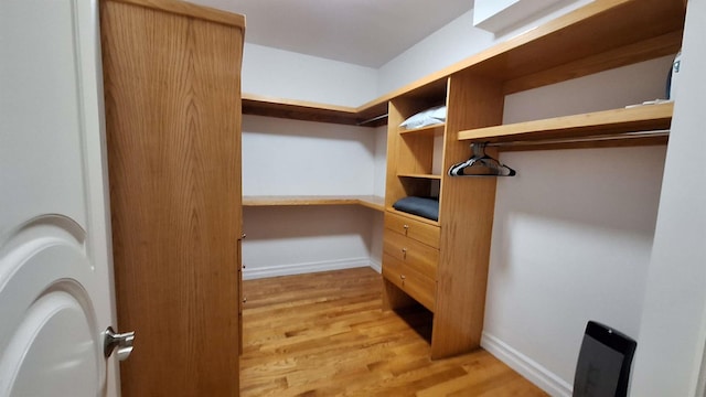 32-37 214th Sts, Bayside, NY 11361 - spacious closet with built in study area and light wood-type flooring