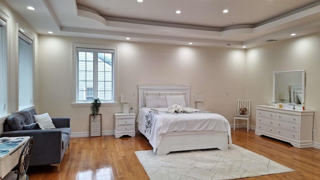 32-37 214th Sts, Bayside, NY 11361 - bedroom featuring a tray ceiling, light wood-style floors, and recessed lighting