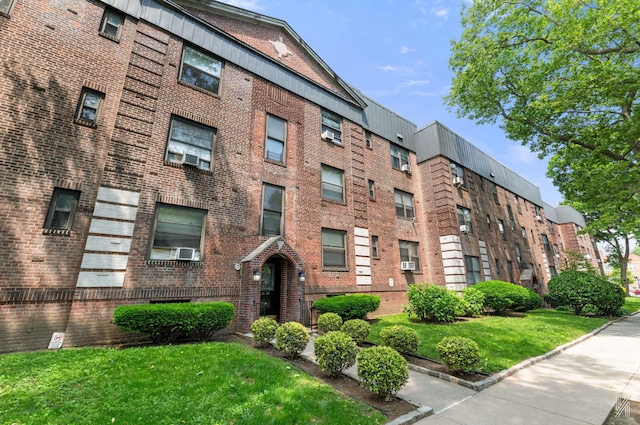 22-20 76th St Unit C3, East Elmhurst, NY 11370 - view of building exterior with cooling unit