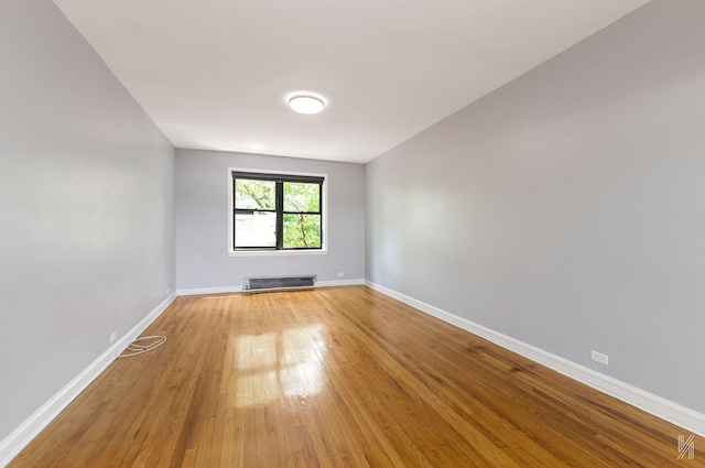 22-20 76th St Unit C3, East Elmhurst, NY 11370 - empty room with light wood-style flooring and baseboards