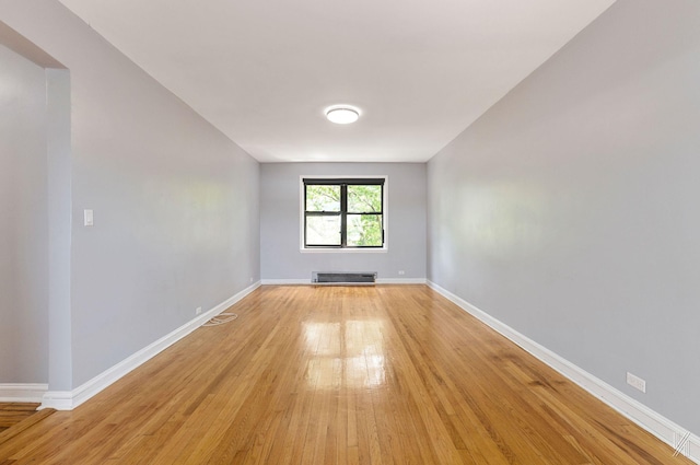 22-20 76th St Unit C3, East Elmhurst, NY 11370 - spare room with light wood-type flooring and baseboards