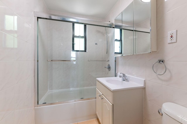 22-20 76th St Unit C3, East Elmhurst, NY 11370 - full bathroom with tile walls, vanity, toilet, and enclosed tub / shower combo