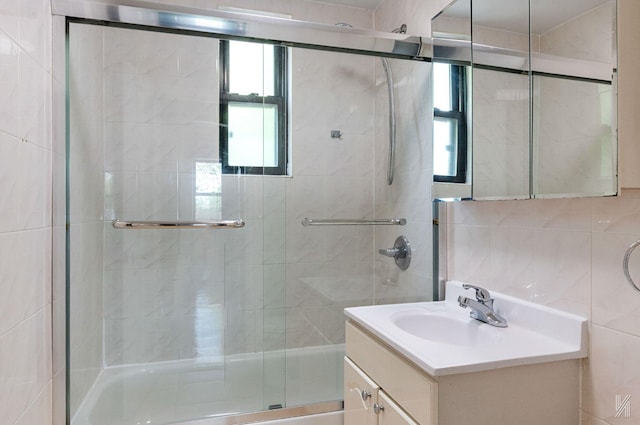 22-20 76th St Unit C3, East Elmhurst, NY 11370 - bathroom with vanity, a stall shower, plenty of natural light, and tile walls