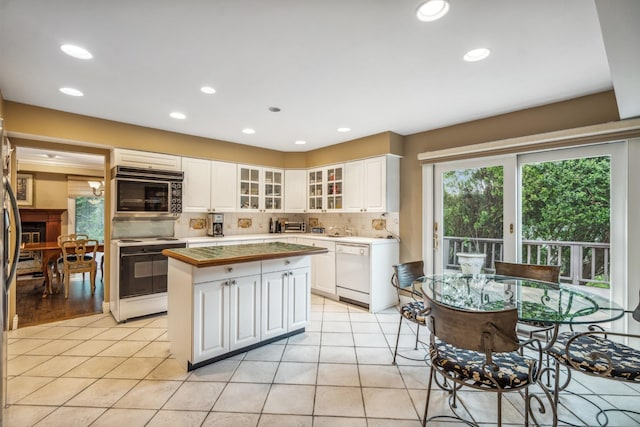 55 Maple Run Dr, Jericho, NY 11753 - kitchen with white appliances, healthy amount of natural light, white cabinetry, backsplash, and recessed lighting