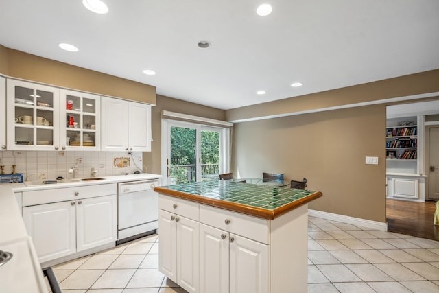 55 Maple Run Dr, Jericho, NY 11753 - kitchen with dishwasher, light tile patterned floors, glass insert cabinets, white cabinets, and recessed lighting