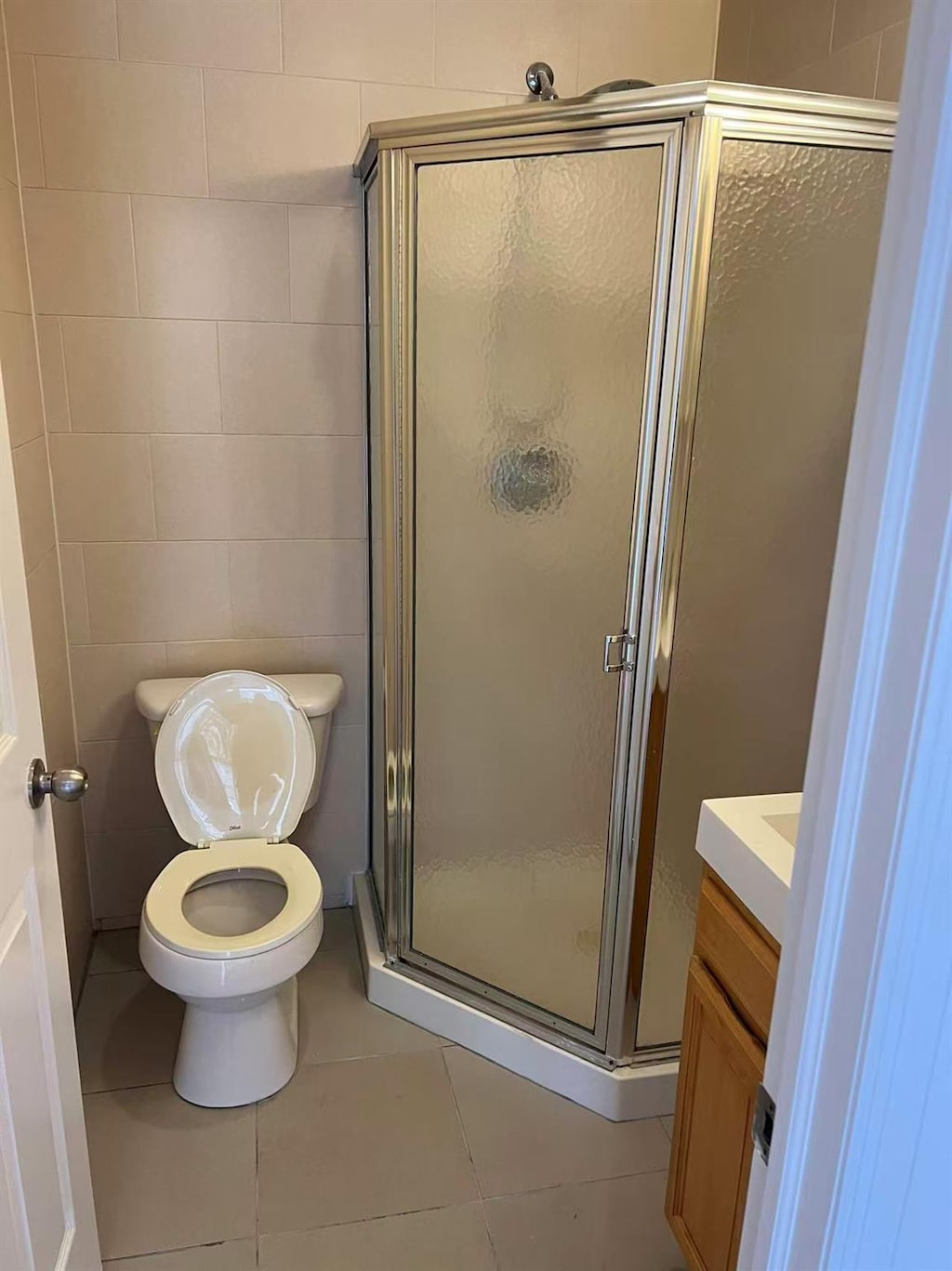 132-73 Maple Ave Unit 4D, Flushing, NY 11355 - full bath featuring vanity, tile patterned flooring, a shower stall, and toilet