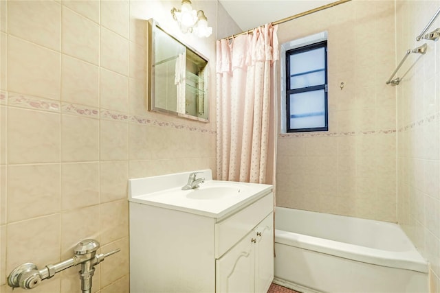 25-11 Union St Unit 2G, Flushing, NY 11354 - bathroom featuring vanity, tile walls, and shower / tub combo