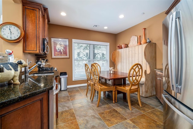 77 Maple Ave Unit 101, Rockville Centre, NY 11570 - dining room featuring dark stone finish floors, baseboards, and recessed lighting