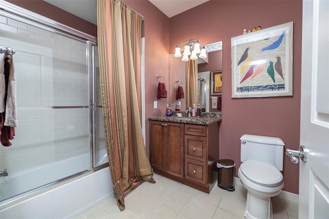 77 Maple Ave Unit 101, Rockville Centre, NY 11570 - bathroom with enclosed tub / shower combo, vanity, tile patterned floors, and toilet