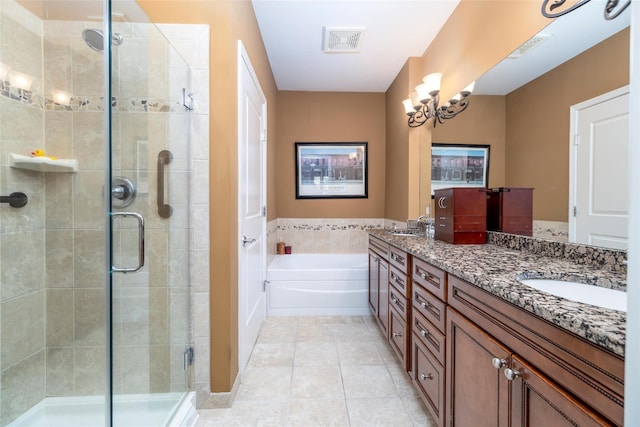 77 Maple Ave Unit 101, Rockville Centre, NY 11570 - full bathroom with double vanity, a bath, a shower stall, and tile patterned floors