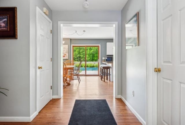 484 N Magee St, Southampton, NY 11968 - hall featuring wood finished floors and baseboards