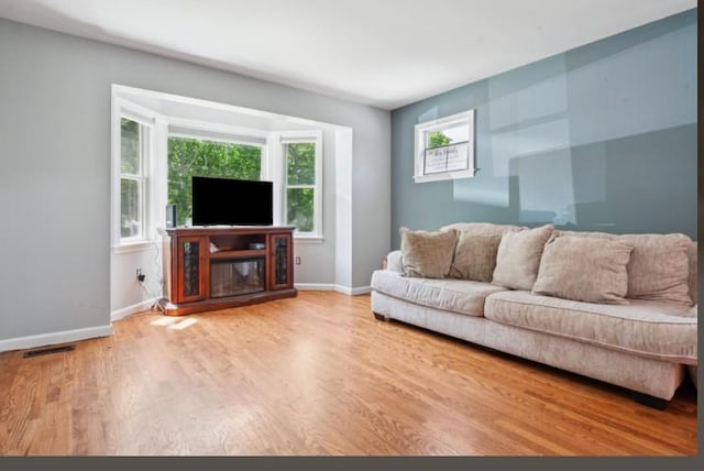484 N Magee St, Southampton, NY 11968 - living room with wood finished floors and baseboards