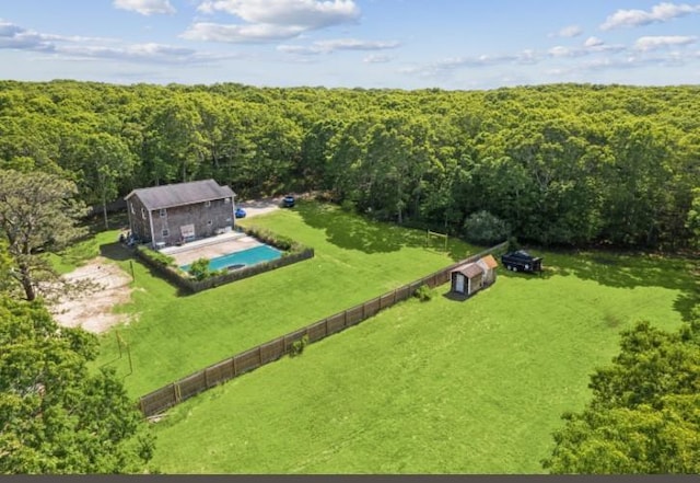 484 N Magee St, Southampton, NY 11968 - aerial view of property and surrounding area with a forest and a pool area