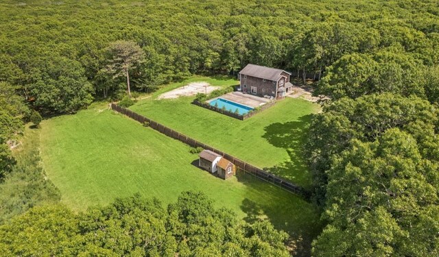 484 N Magee St, Southampton, NY 11968 - view of subject property with a forest and a pool
