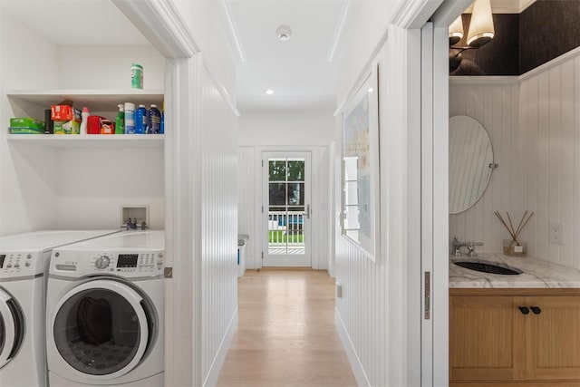 41 Landing Ln, East Quogue, NY 11942 - washroom featuring washer and clothes dryer and light wood-type flooring