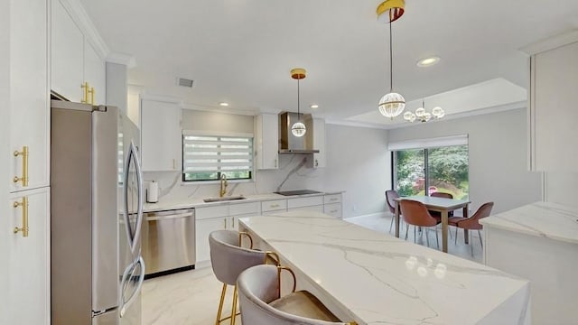 14 Acorn Ponds Dr Unit 14, Roslyn, NY 11576 - kitchen with stainless steel appliances, wall chimney range hood, white cabinetry, a sink, and ornamental molding