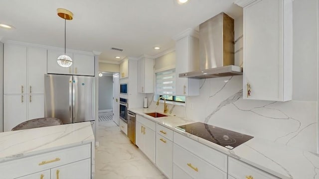 14 Acorn Ponds Dr Unit 14, Roslyn, NY 11576 - kitchen with wall chimney range hood, appliances with stainless steel finishes, a sink, white cabinetry, and hanging light fixtures