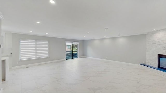 14 Acorn Ponds Dr Unit 14, Roslyn, NY 11576 - unfurnished living room with a fireplace, baseboards, recessed lighting, and light marble finish flooring