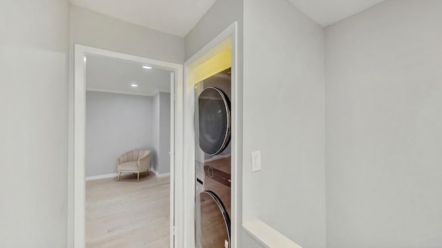 14 Acorn Ponds Dr Unit 14, Roslyn, NY 11576 - laundry room featuring stacked washing machine and dryer, wood finished floors, recessed lighting, and baseboards
