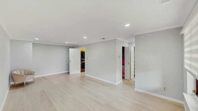 14 Acorn Ponds Dr Unit 14, Roslyn, NY 11576 - unfurnished room featuring stacked washer / drying machine, light wood-style floors, recessed lighting, baseboards, and ornamental molding